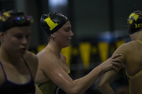 Iowa swimmer Anna Brooker wishes a teammate good luck during a meet against the University of Northern Iowa  at the Campus Recreation and Wellness Center on Friday, Oct. 1, 2021. The Panthers defeated the Hawkeyes 159-133.