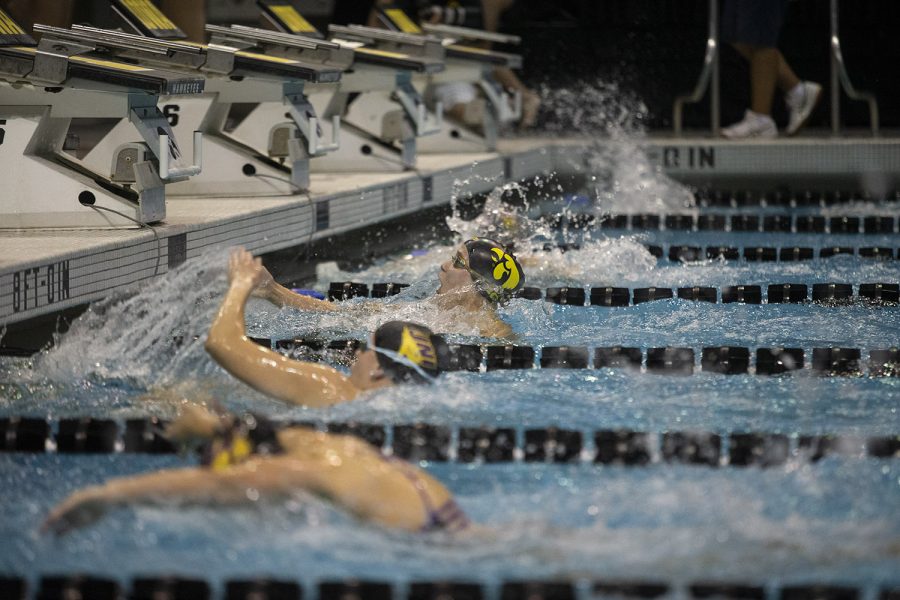 Iowa’s Zoe Pawloski finishes the 100 yard butterfly against the University of Northern Iowa at the Campus Recreation and Wellness Center on Friday, Oct. 1, 2021. Pawloski finished fifth with a time of 1:04.73. The Panthers defeated the Hawkeyes 159-133.