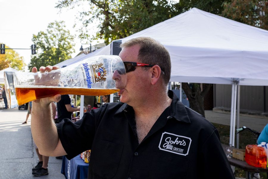 Doug Alberhasky stops to take a drink while checking to see that things are running smoothly at the 25th BrewFest/6th Annual Northside Oktoberfest on Saturday, Oct. 2, 2021. Alberhasky, the store manage of John’s Grocery, has been part of the event for several years. 