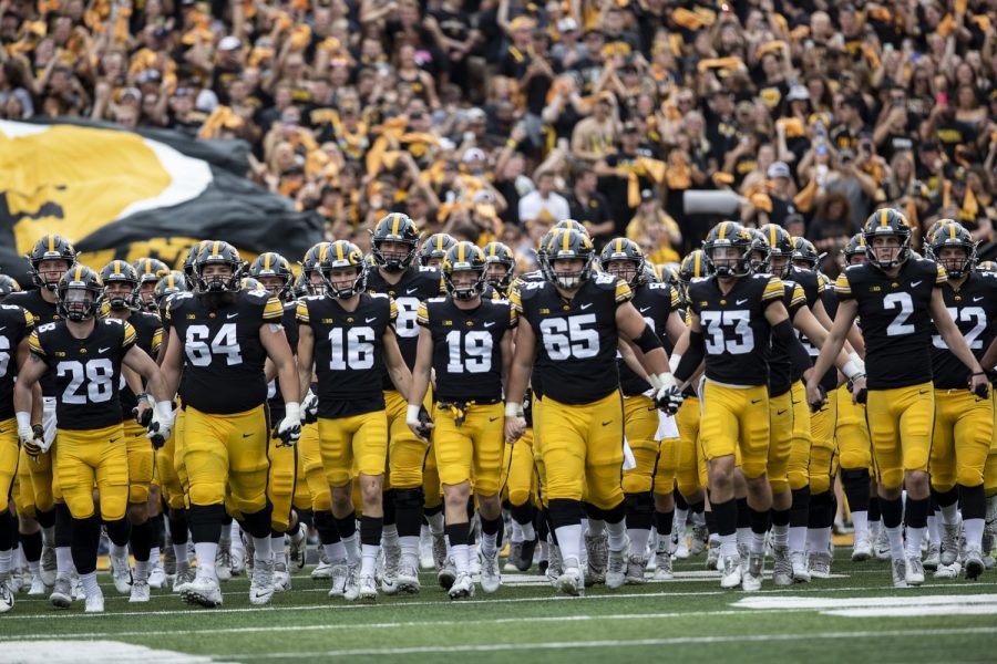 Iowa walks onto the field before a football game between No. 3 Iowa and No. 4 Penn State at Kinnick Stadium on Saturday, Oct. 9, 2021. The Hawkeyes defeated the Nittany Lions 23-20. (Grace Smith/The Daily Iowan)
