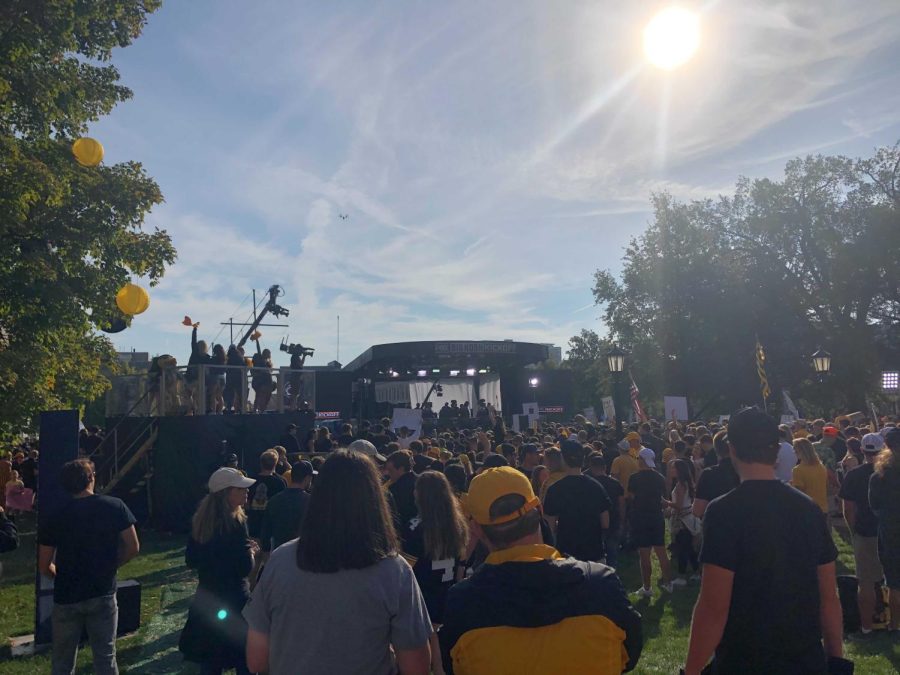 Hawkeye fans listen to sports commentator Rob Stone during the Big Noon Kickoff pregame show on the University of Iowa’s pentacrest on Saturday, Oct. 9, 2021. No. 3 Iowa and No. 5 Penn State, both undefeated, will face-off at 3pm at Kinnick Stadium in Iowa City, Iowa.