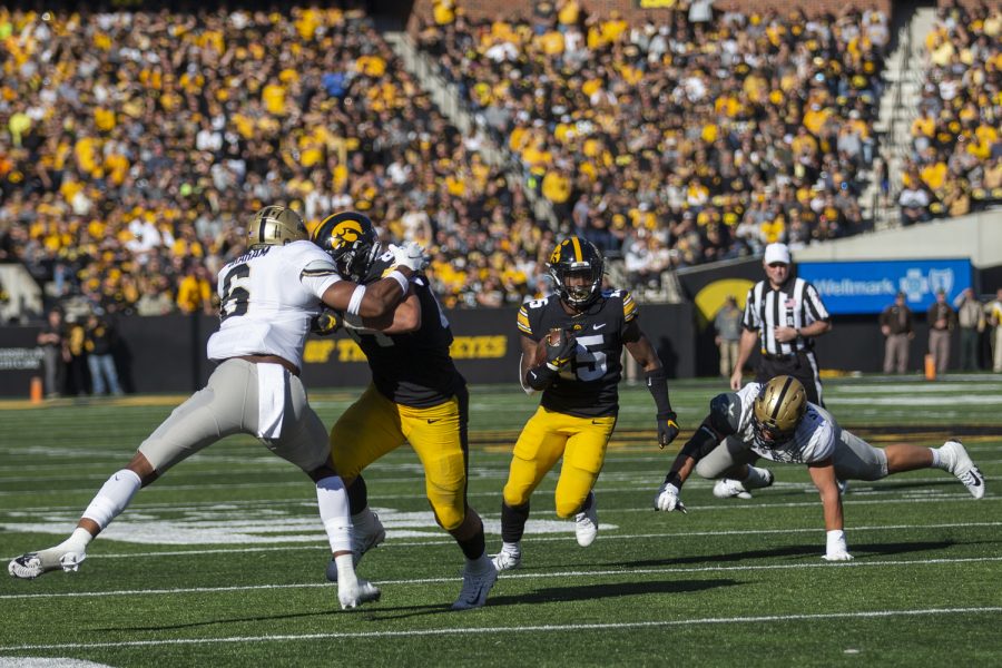 Iowa+running+back+Tyler+Goodson+finds+running+room+during+a+football+game+between+No.+2+Iowa+and+Purdue+at+Kinnick+Stadium+on+Saturday%2C+Oct.+16%2C+2021.+The+Boilermakers+defeated+the+Hawkeyes+24-7.+%28Jerod+Ringwald%2FThe+Daily+Iowan%29