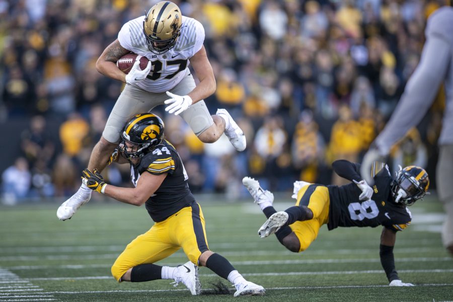 Purdue tight end Payne Durham comes down after hurdling Iowa defensive back Matt Hankins during a football game between No. 2 Iowa and Purdue at Kinnick Stadium on Saturday, Oct. 16, 2021. The Boilermakers defeated the Hawkeyes 24-7. Durham had 15 yards on five receptions. 