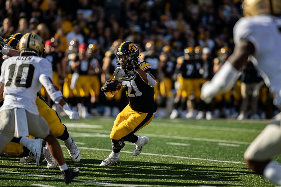Iowa running back Ivory Kelly-Martin carries the ball during a football game between No. 2 Iowa and Purdue at Kinnick Stadium on Saturday, Oct. 16, 2021. The Boilermakers defeated the Hawkeyes 24-7. Kelly-Martin had six rushes for 23 yards and a touchdown. 