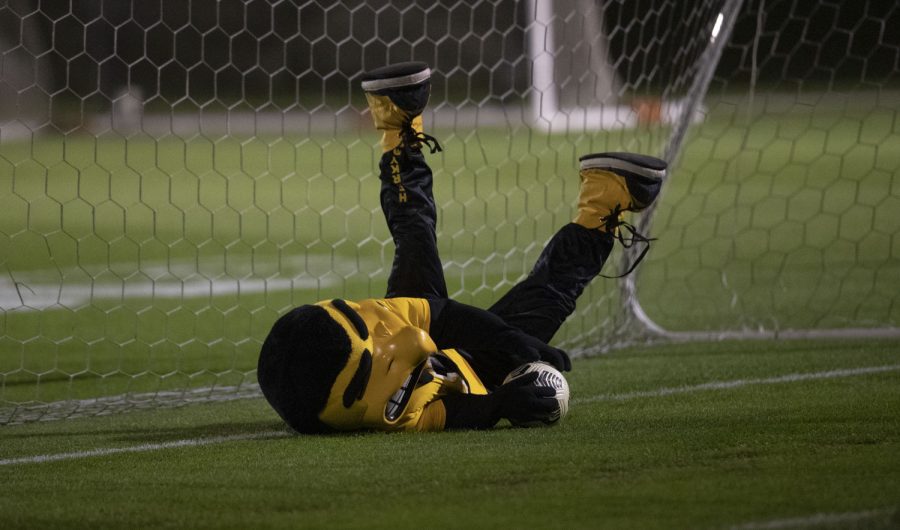 Herky the Hawkeye dives to save a goal during halftime at a soccer game between Iowa and Minnesota at the UI Soccer Complex on Thursday Oct. 21, 2021. The Hawkeyes defeated the Gophers 1-0. 