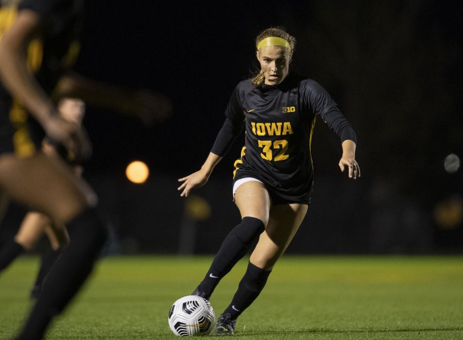 Iowa midfielder Maggie Johnston pushes the ball up the field during a soccer game between Iowa and Minnesota at the UI Soccer Complex on Thursday Oct. 21, 2021. The Hawkeyes defeated the Gophers 1-0. 