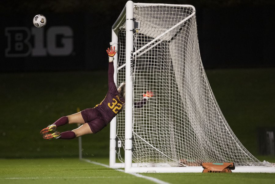 University of Minnesota goalkeeper Megan Plaschko jumps to try to stop a goal attempt during a soccer game between Iowa and Minnesota at the UI Soccer Complex on Thursday Oct. 21, 2021. The Hawkeyes defeated the Gophers 1-0. 