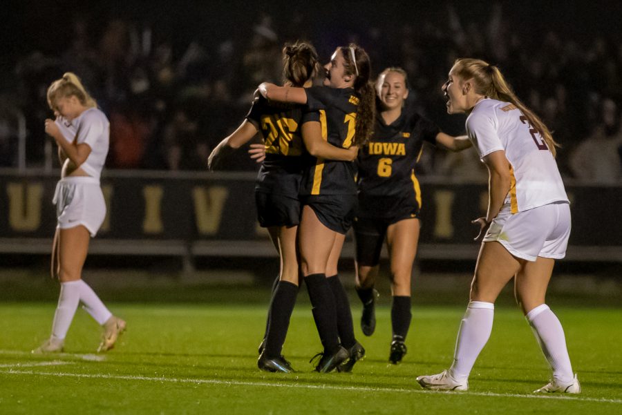 Iowa's squad celebrates the goal scored during a soccer game between Iowa and Minnesota at the UI Soccer Complex in Iowa City on Thursday, Oct. 21, 2021.The Hawkeyes defeated the Gophers 1-0.