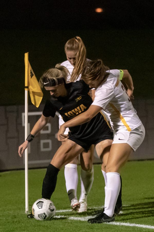 The ball goes out, but the play goes on as the referee does not call out-of-bounds during a soccer game between Iowa and Minnesota at the UI Soccer Complex in Iowa City on Thursday, Oct. 21, 2021.The Hawkeyes defeated the Gophers 1-0. (Larry Phan/The Daily Iowan)