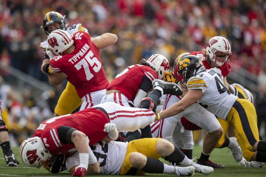 Wisconsin running back Chez Mellusi fights for yards during a football game between No. 9 Iowa and Wisconsin at Camp Randall Stadium on Saturday, Oct. 30, 2021. (Jerod Ringwald/The Daily Iowan)