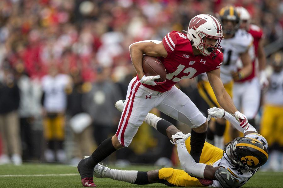 Wisconsin+wide+receiver+Chimere+Dike+pushes+down+Iowa+defensive+back+Jerami+Harris+after+catching+a+pass+during+a+football+game+between+No.+9+Iowa+and+Wisconsin+at+Camp+Randall+Stadium+on+Saturday%2C+Oct.+30%2C+2021.+%28Jerod+Ringwald%2FThe+Daily+Iowan%29
