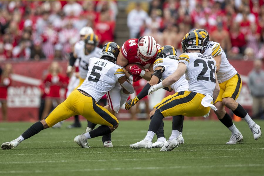 Wisconsin+fullback+John+Chenal+fights+for+yards+during+a+football+game+between+No.+9+Iowa+and+Wisconsin+at+Camp+Randall+Stadium+on+Saturday%2C+Oct.+30%2C+2021.+The+Badgers+defeated+the+Hawkeyes+27-7.+%28Jerod+Ringwald%2FThe+Daily+Iowan%29