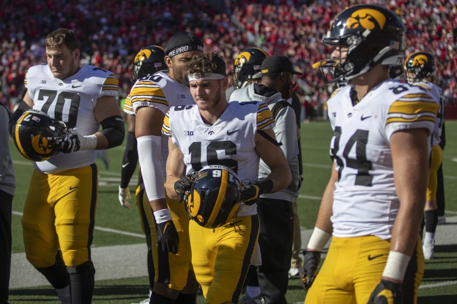 Iowa+wide+receiver+Charlie+Jones+walks+off+the+sideline+with+his+helmet+during+a+football+game+between+No.+9+Iowa+and+Wisconsin+at+Camp+Randall+Stadium+on+Saturday%2C+Oct.+30%2C+2021.+The+Badgers+defeated+the+Hawkeyes+27-7.+%28Jerod+Ringwald%2FThe+Daily+Iowan%29