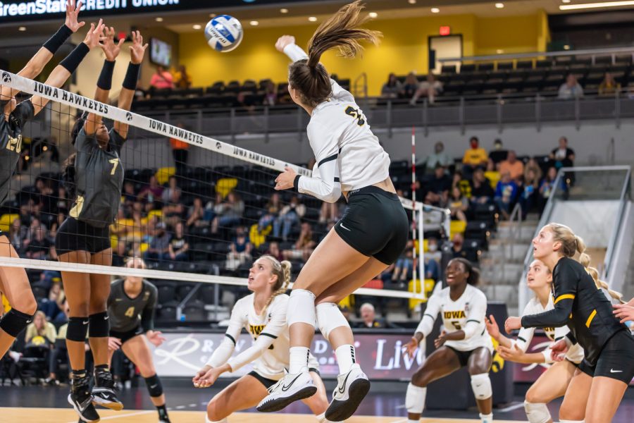 Iowa setter/rightside hitter Courtney Buzzerio jumps to spike the ball during the volleyball game between Iowa and Purdue at Xtream Arena on Saturday, Oct. 9, 2021. Purdue defeated Iowa 3-0. 