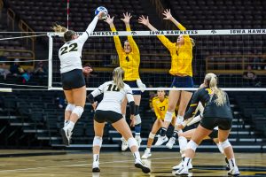 Iowa outside hitter Addie VanderWeide sends the ball over the net during a volleyball game between Iowa and Michigan at Carver-Hawkeye Arena on Saturday, Oct. 2, 2021. Michigan defeated Iowa 3-0. 