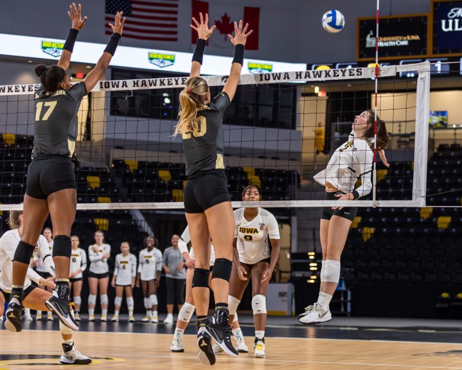Iowa setter/ rightside hitter Courtney Buzzerio jumps to spike the ball during the volleyball game between Iowa and Purdue at Xtream Arena on Saturday, Oct. 9, 2021. Purdue defeated Iowa 3-0. 