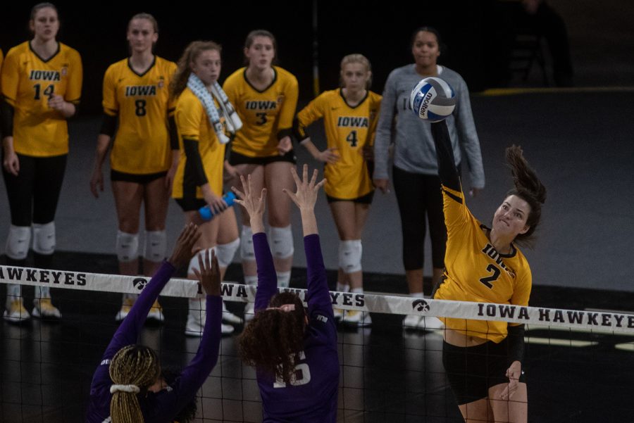 Iowa right-side hitter Courtney Buzzerio goes for the kill during a volleyball match at Xtream Arena in Iowa City on Saturday, Oct. 16, 2021. Buzzerio recorded 13 kills in the match. The Wildcats defeated the Hawkeyes 3-0.
