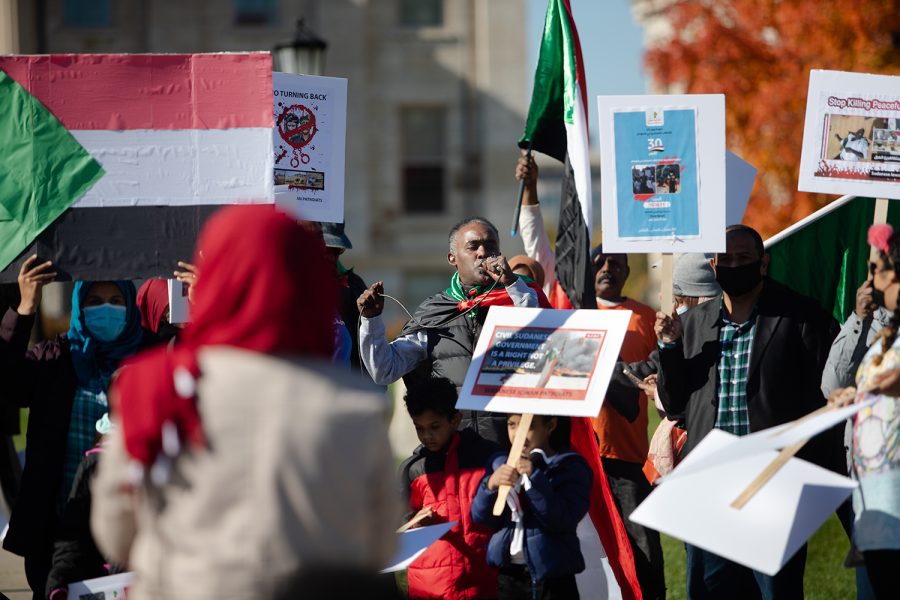 A protester speaks during a protest against a military coup in Sudan on Saturday, Oct. 30, 2021. Around 100 people came and showed their support after the first protest earlier that week. (Gabby Drees/The Daily Iowan)
