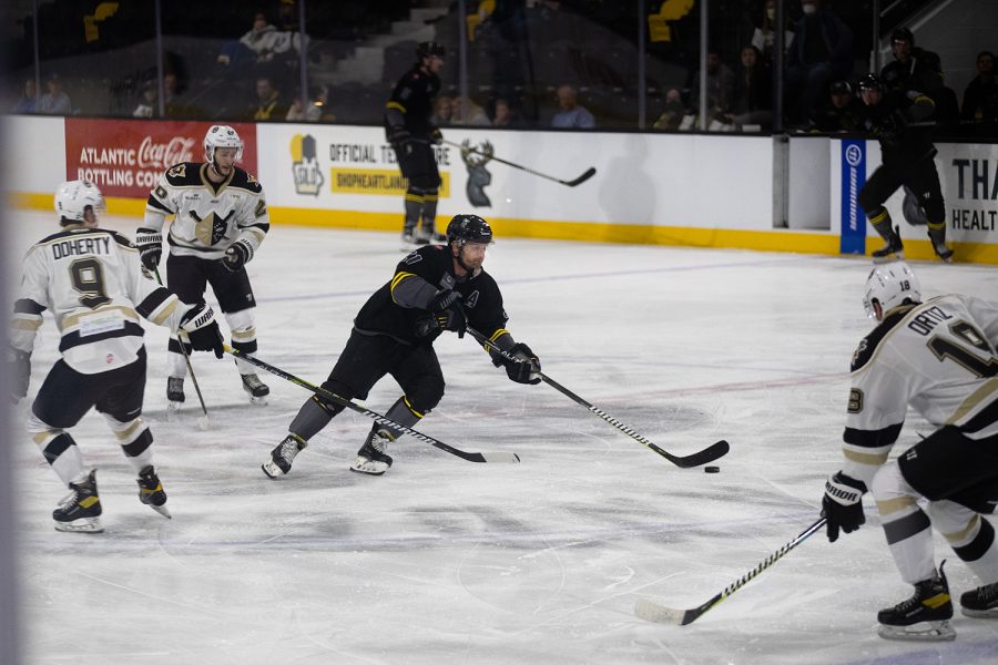 Nailers surround center Tyler Mosienko during a hockey game between the Iowa Heartlanders and the Wheeling Nailers at the Xtream Arena in Coralville, Iowa on Wednesday, Oct. 27, 2021. Mosienko had one assist. The Wheeling Nailers defeated the Heartlanders 4-3. 