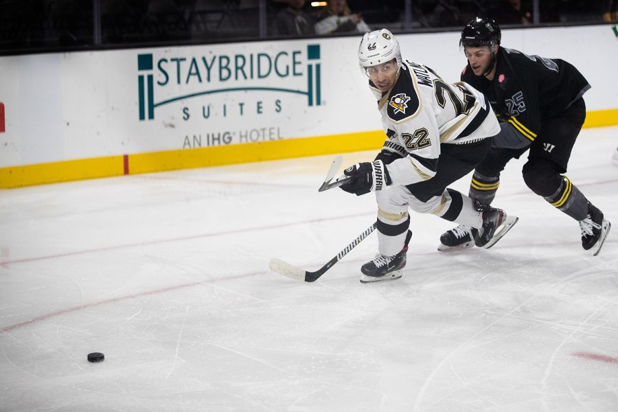 Forward Patrick Watling goes for the puck during a hockey game between the Iowa Heartlanders and the Wheeling Nailers at the Xtream Arena in Coralville, Iowa on Wednesday, Oct. 27, 2021. The Wheeling Nailers defeated the Heartlanders 4-3. 
