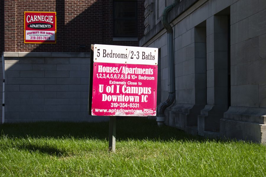 An apartment sign is seen downtown Iowa City on Tuesday, Oct. 19, 2021. (Raquele Decker/The Daily Iowan)