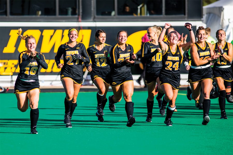 Iowa players celebrate the win after the field hockey game between No.1 Iowa and No. 2 Michigan on Friday, Oct. 15, 2021, at Grant Field. The Hawkeyes defeated the Wolverines 2-1 in double overtime and a shootout.(Jeff Sigmund/Daily Iowan)