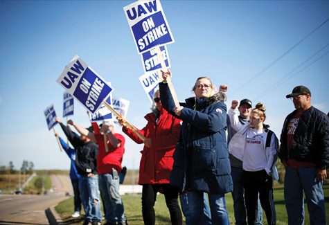 Members of the United Auto Workers strike outside of the John Deere Engine Works plant on Ridgeway Avenue in Waterloo, Iowa, on Friday, Oct. 15, 2021. About 10,000 UAW workers have gone on strike against John Deere since Thursday at plants in Iowa, Illinois and Kansas.