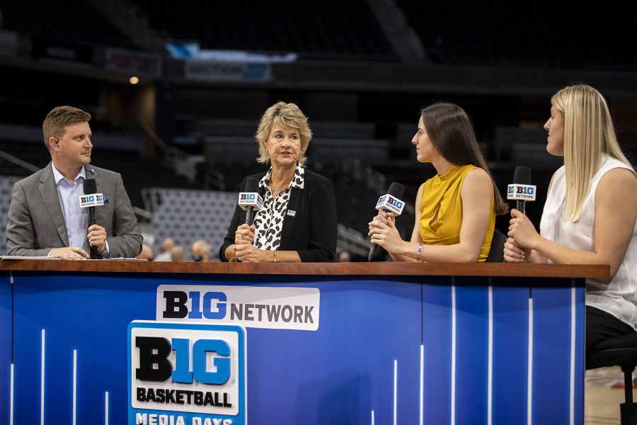 Iowa women’s head basketball coach Lisa Bluder speaks with Big Ten Network broadcaster Mike Hall and players Caitlin Clark and Monika Czinano during Big Ten Basketball Media Days at Gainbridge Fieldhouse in Indianapolis, Indiana on Thursday, Oct. 7, 2021. 