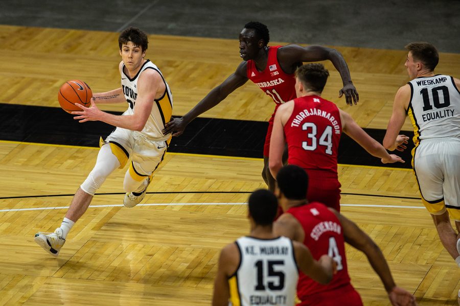 Iowa Forward Patrick McCaffery (22) moves the ball during an Iowa men’s basketball game against Nebraska on Thursday, March 4, 2021 at Carver-Hawkeye arena. The Hawks beat the Cornhuskers, 102-64. (Kate Heston/The Daily Iowan)