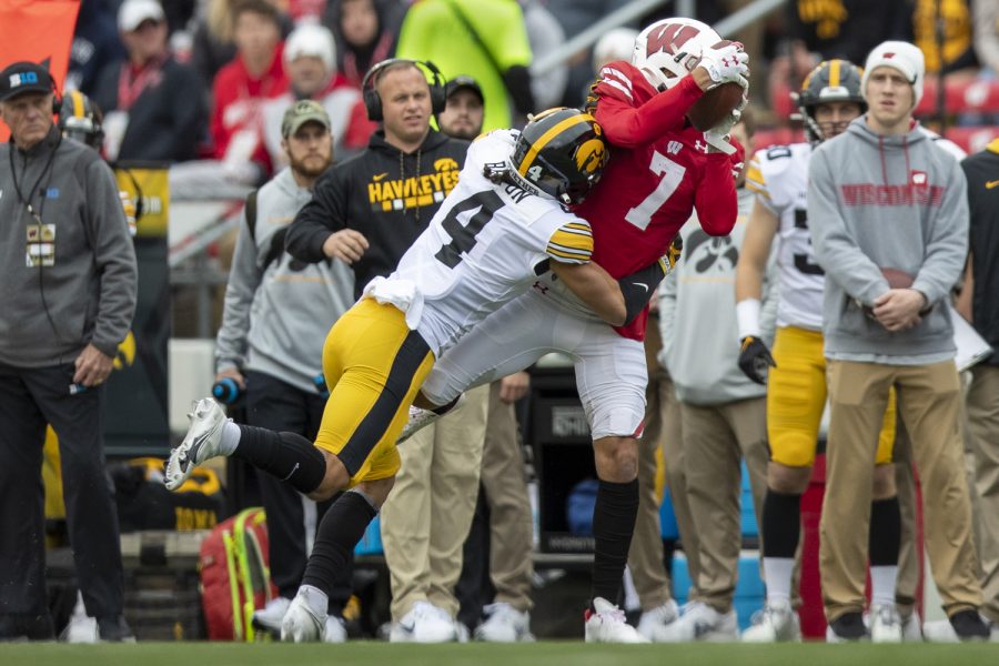 Wisconsin wide receiver Danny Davis III makes a catch over Iowa defensive back Dane Belton during a football game between No. 9 Iowa and Wisconsin at Camp Randall Stadium on Saturday, Oct. 30, 2021. Davis III averaged 11.8 yards per reception. The Badgers defeated the Hawkeyes 27-7. 