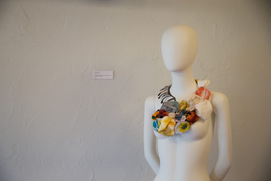 A mannequin shows off Dufié Sakyiama’s piece, “Patience,” during the Threads & Powders fashion and textile exhibit at Englert Civic Theater on Friday, Sept. 10, 2021. (Cecilia Shearon/The Daily Iowan)