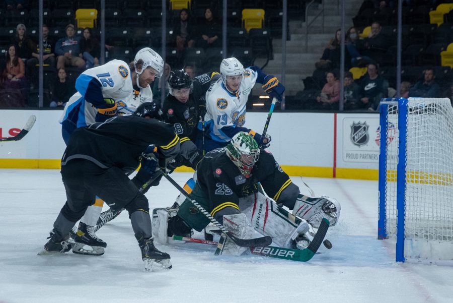 The puck slips past the goalie during a hockey match between the Iowa Heartlanders and the Toledo Walleye at the Xtream Arena in Coralville, Iowa, on Saturday, Oct. 30, 2021. The Walleye defeated the Heartlanders 5-2. 