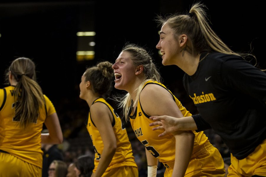 Iowa center Monika Czinano and forward AJ Ediger celebrate a three pointer during an exhibition women’s basketball game between Iowa and Truman State at Carver-Hawkeye Arena in Iowa City on Thursday, Nov. 4, 2021. The Hawkeyes defeated the Bulldogs 102-32. 