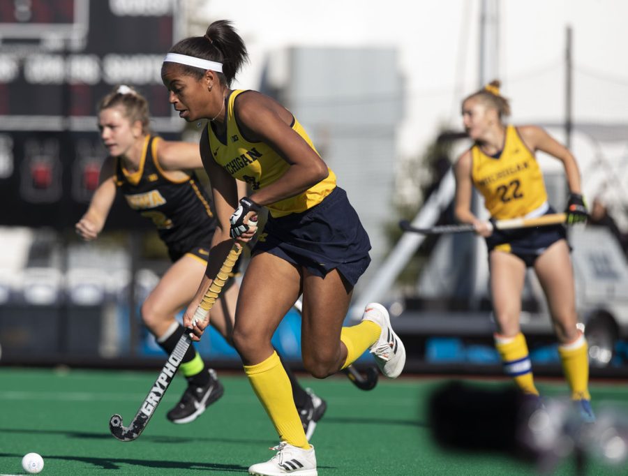Michigan midfielder Nina Apoola pushes the ball down the field at the Field Hockey Big Ten Tournament Semi-Finals between Iowa and Michigan at Bauer Track & Field Complex on Friday, Nov. 5, 2021. The Wolverines defeated the Hawkeyes 3-2. 