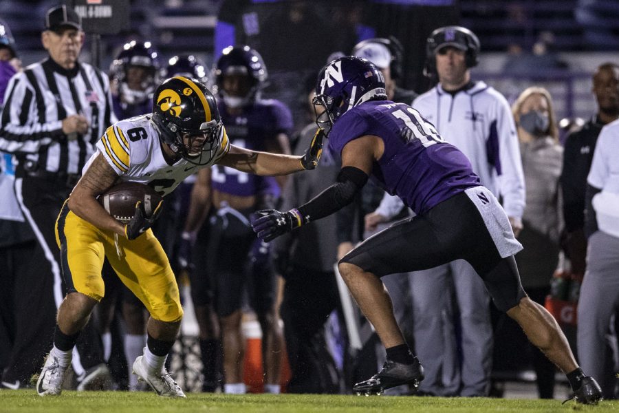 Iowa wide receiver Keagan Johnson runs the ball during a football game between No. 19 Iowa and Northwestern at Ryan Field in Evanston, Illinois, on Saturday, Nov. 6, 2021. The Hawkeyes defeated the Wildcats 17-12. 
