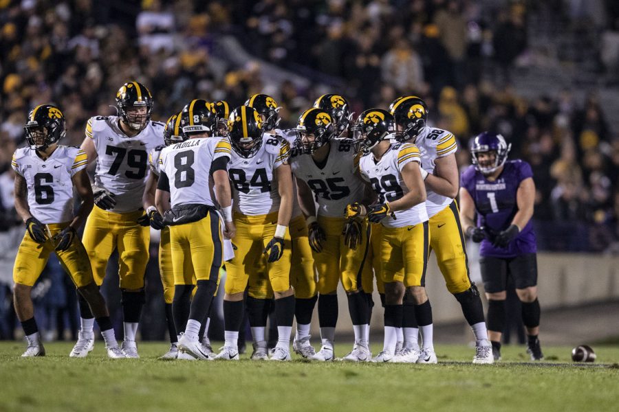 Iowa+offense+huddles+up+before+lining+up+the+line+of+scrimmage+during+a+football+game+between+No.+19+Iowa+and+Northwestern+at+Ryan+Field+in+Evanston%2C+Illinois%2C+on+Saturday%2C+Nov.+6%2C+2021.+The+Hawkeyes+defeated+the+Wildcats+17-12.+%28Grace+Smith%2FThe+Daily+Iowan%29
