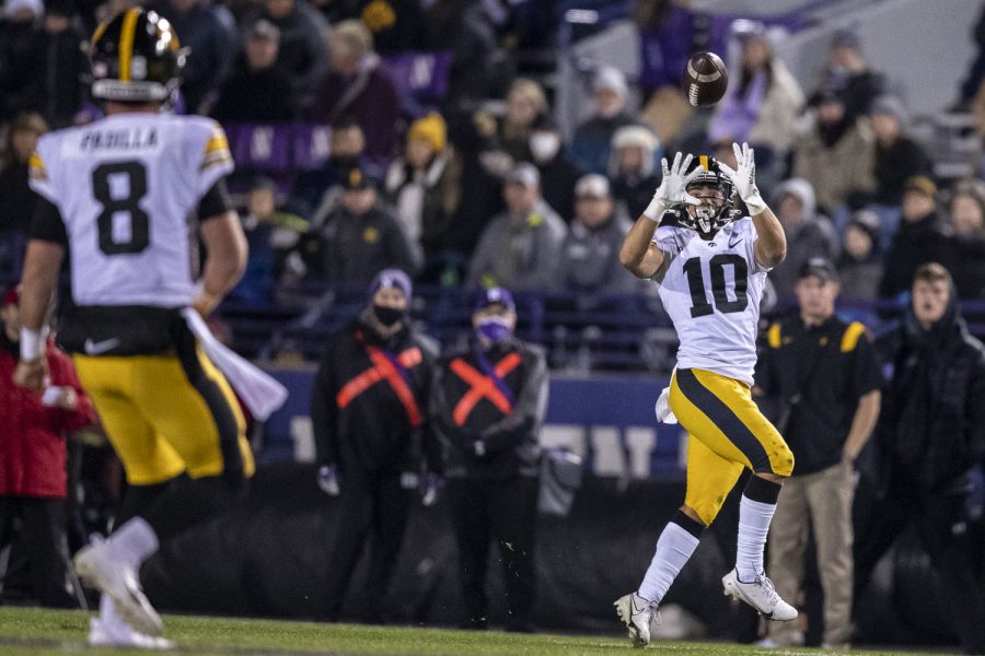 Iowa+quarterback+Alex+Padilla+passes+the+ball+to+wide+receiver+Arland+Bruce+IV+during+a+football+game+between+No.+19+Iowa+and+Northwestern+at+Ryan+Field+in+Evanston%2C+Illinois%2C+on+Saturday%2C+Nov.+6%2C+2021.+The+Hawkeyes+defeated+the+Wildcats+17-12.+%28Grace+Smith%2FThe+Daily+Iowan%29