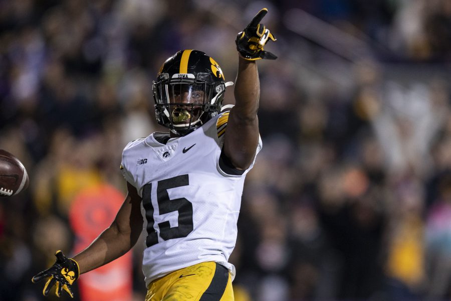 Iowa running back Tyler Goodson points to Iowa fans after his touchdown during a football game between No. 19 Iowa and Northwestern at Ryan Field in Evanston, Illinois, on Saturday, Nov. 6, 2021. (Grace Smith/The Daily Iowan)