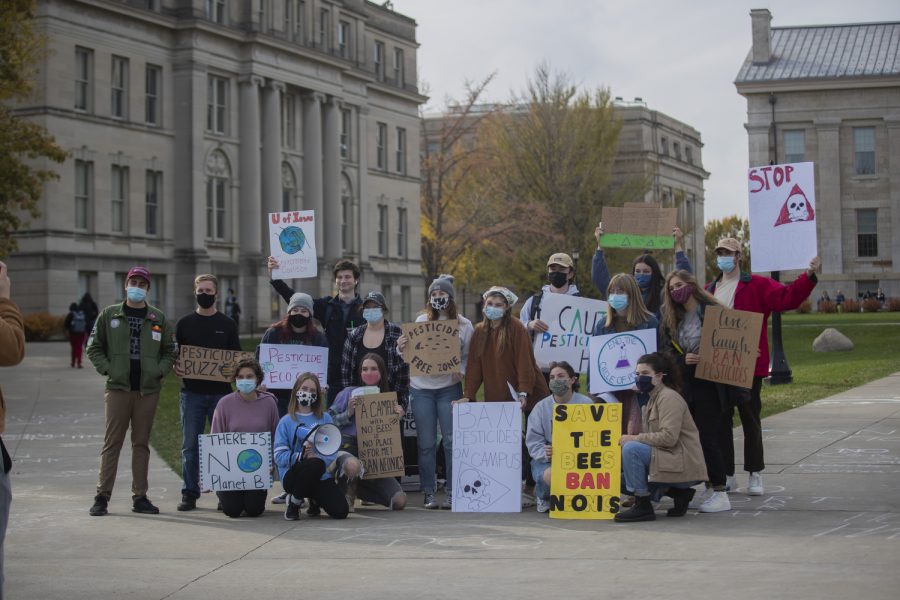 Protestors take a group picture during a protest against pesticides held by University of Iowa Environmental Coalition at the Pentacrest Tuesday, Nov. 9, 2021. 