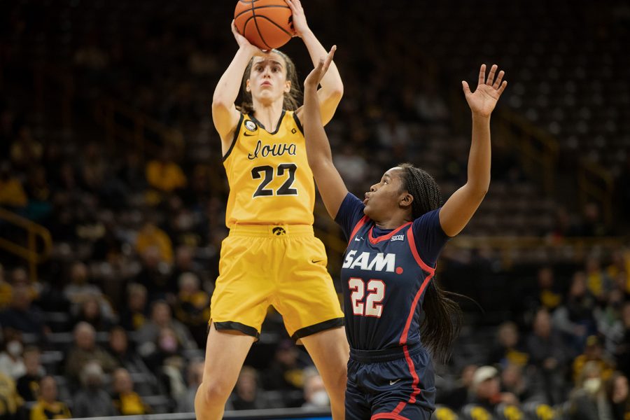 Iowa guard Caitlin Clark shoots a shot over Samford guard Sanna Redmond during a women’s basketball game between Iowa and Samford at Carver-Hawkeye Arena in Iowa City on Thursday, Nov. 11, 2021. The Hawkeyes defeated the Bulldogs, 91-54.