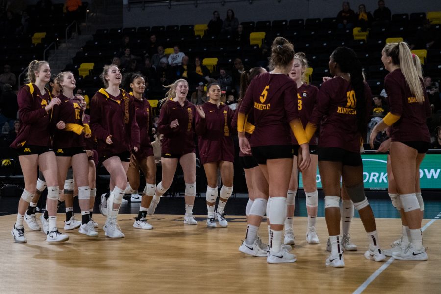 The Minnesota team all comes together to celebrate the victory after defeating Iowa during a volleyball match between Iowa and Minnesota at Xtream Arena in Coralville on Thursday, Nov. 11, 2021. The Gophers beat the Hawkeyes 3-0.