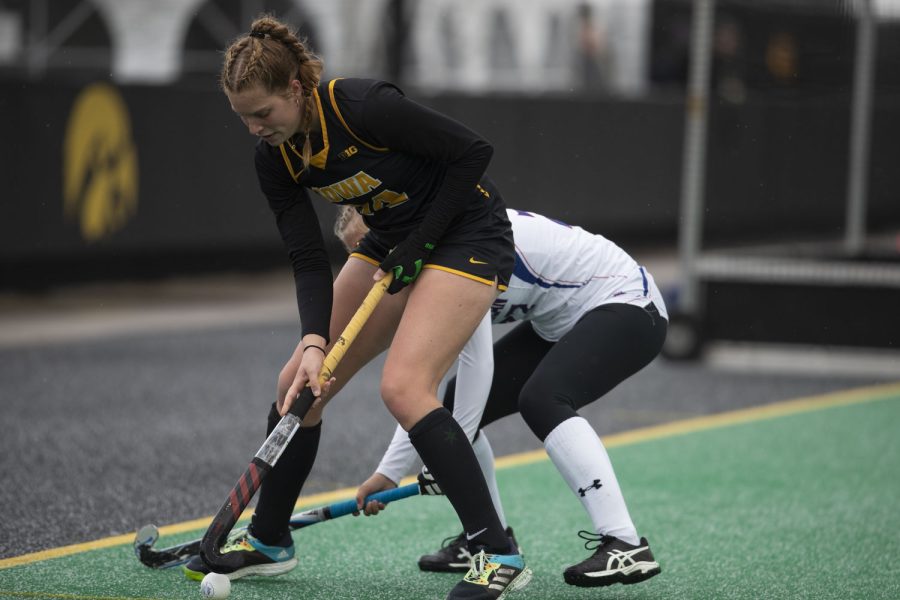 Iowa midfielder Lokke Stribos works to move around American University during the Sweet Sixteen round of the 2021 NCAA Field Hockey Tournament between Iowa and American University at Grant Field in Iowa City on Friday, Nov. 12, 2021. The Hawkeyes defeated the Eagles, 3-2.