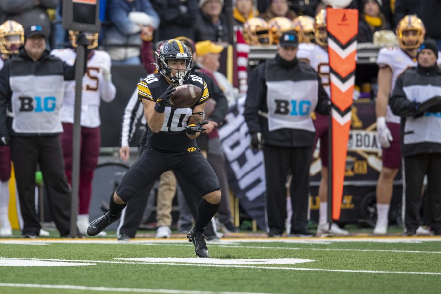Iowa wide receiver Arland Bruce IV catches a pass during a football game between Iowa and Minnesota at Kinnick Stadium in Iowa City on Saturday, Nov. 13, 2021. (Jerod Ringwald/The Daily Iowan)