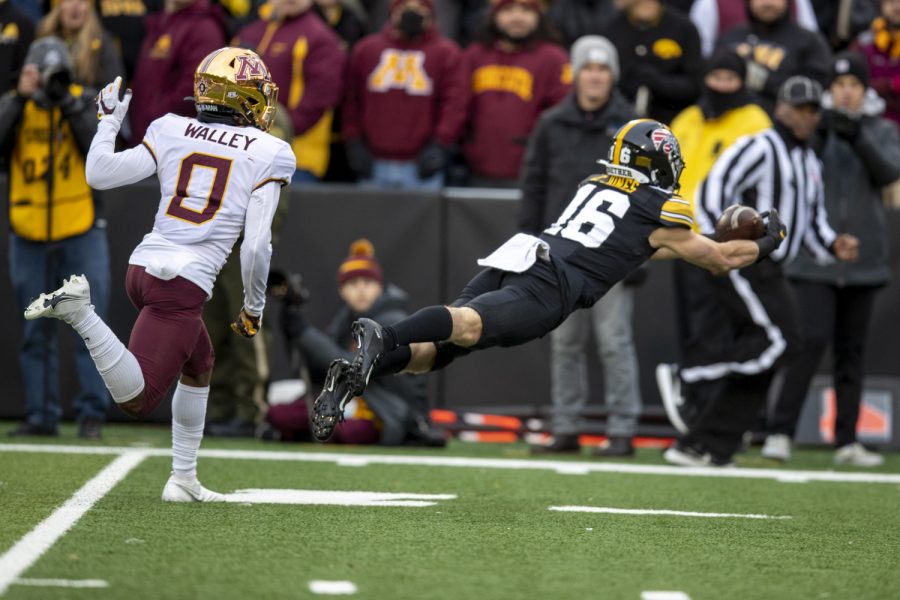 Iowa wide receiver Charlie Jones dives for a catch during a football game between Iowa and Minnesota at Kinnick Stadium in Iowa City on Saturday, Nov. 13, 2021.