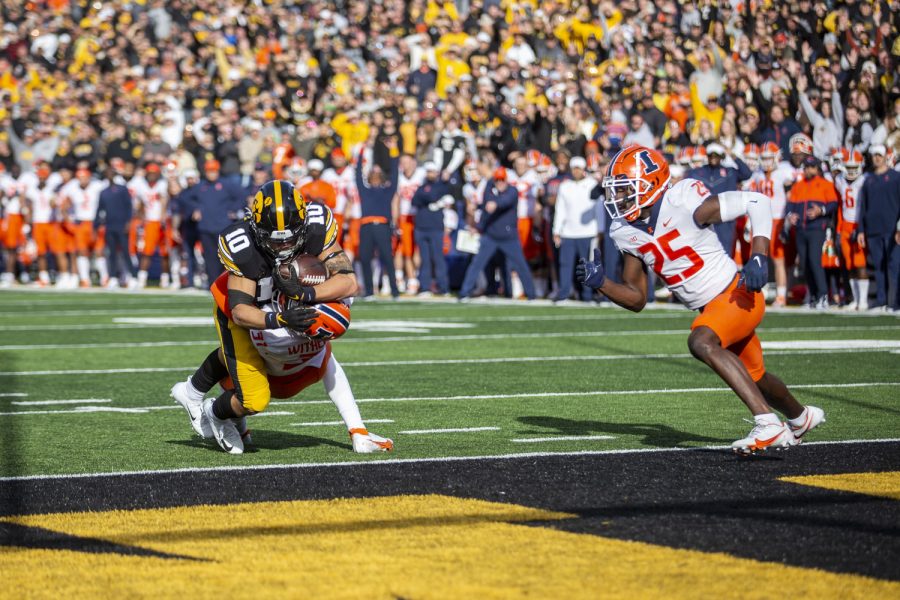 Iowa wide receiver Arland Bruce IV dives into the end zone during a football game between No. 17 Iowa and Illinois at Kinnick Stadium on Saturday, Nov. 20, 2021. Bruce had one touchdown on the day and four carries. The Hawkeyes defeated the Fighting Illini 33-23 at the last Iowa home game of the season. 