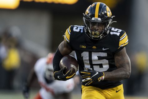 Iowa running back Tyler Goodson carries the ball during a football game between No. 17 Iowa and Illinois at Kinnick Stadium in Iowa City on Saturday, Nov. 20, 2021. Goodson had 27 carries on the day averaging 4.9 yards per carry. The Hawkeyes defeated the Fighting Illini 33-23 at the last home game of the season.