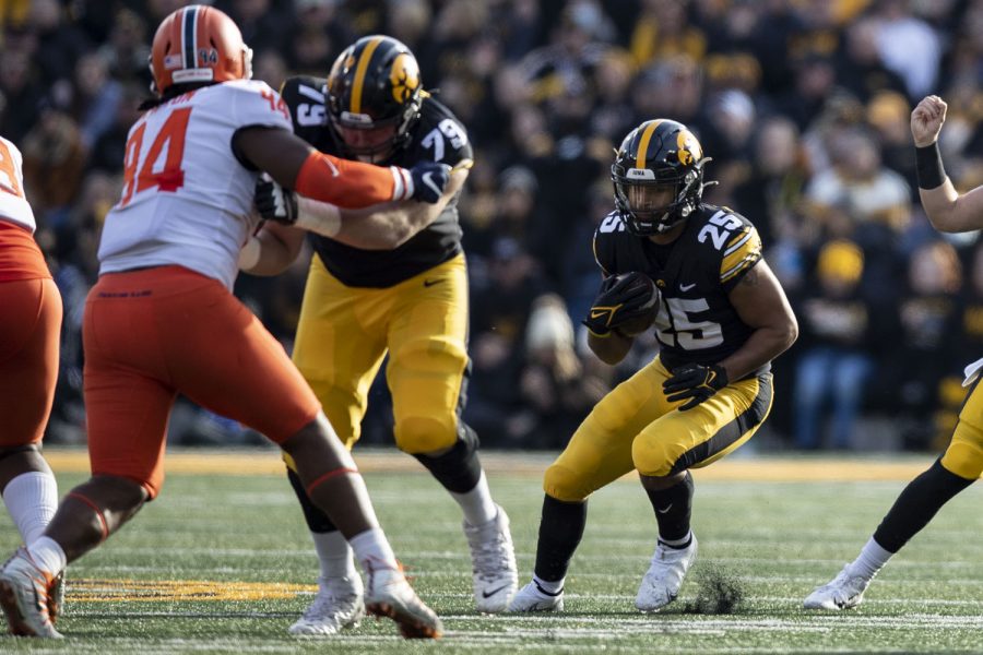 Iowa running back Gavin Williams rushes the ball during a football game between No. 17 Iowa and Illinois at Kinnick Stadium in Iowa City on Saturday, Nov. 20, 2021. The Hawkeyes defeated the Illini 33-23 at the last home game of the season. 