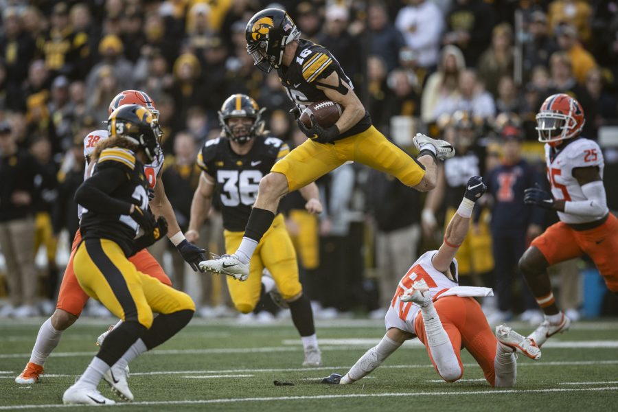 Iowa+wide+receiver+Charlie+Jones+hurdles+over+Illinois+defensive+back+Christian+Bobak+during+a+football+game+between+No.+17+Iowa+and+Illinois+at+Kinnick+Stadium+in+Iowa+City+on+Saturday%2C+Nov.+20%2C+2021.+The+Hawkeyes+defeated+the+Illini%2C+33-23%2C+at+the+last+home+game+of+the+season.+