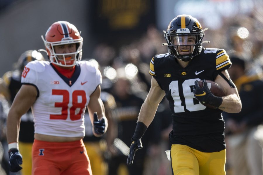 Iowa wide receiver Charlie Jones runs the ball down the field after a kick return during a football game between No. 17 Iowa and Illinois at Kinnick Stadium in Iowa City on Saturday, Nov. 20, 2021. (Grace Smith/The Daily Iowan)