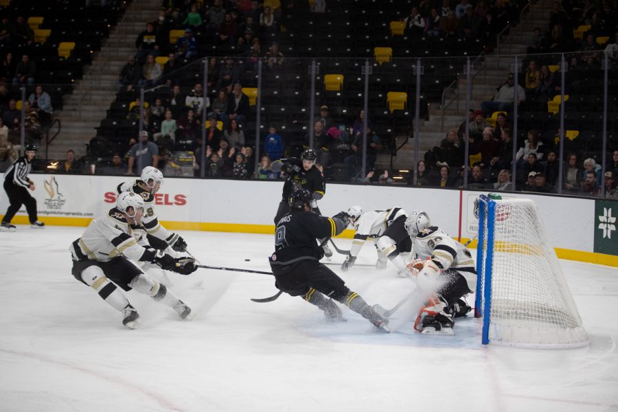 Heartlanders forward Bryce Gervais halts to a stop in the Wheeling Nailers’ goalie crease during a hockey game between the Heartlanders and the Wheeling Nailers in Xtream Arena in Coralville on Saturday, Nov. 27, 2021. The Wheeling Nailers defeated the Heartlanders 4-2. 